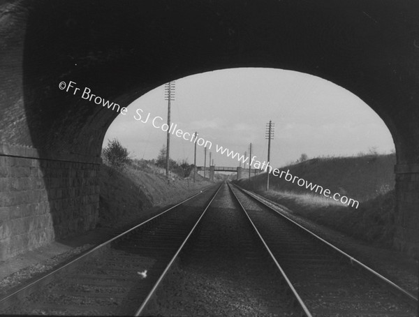 TRACKS CONVERGE UNDER BRIDGE